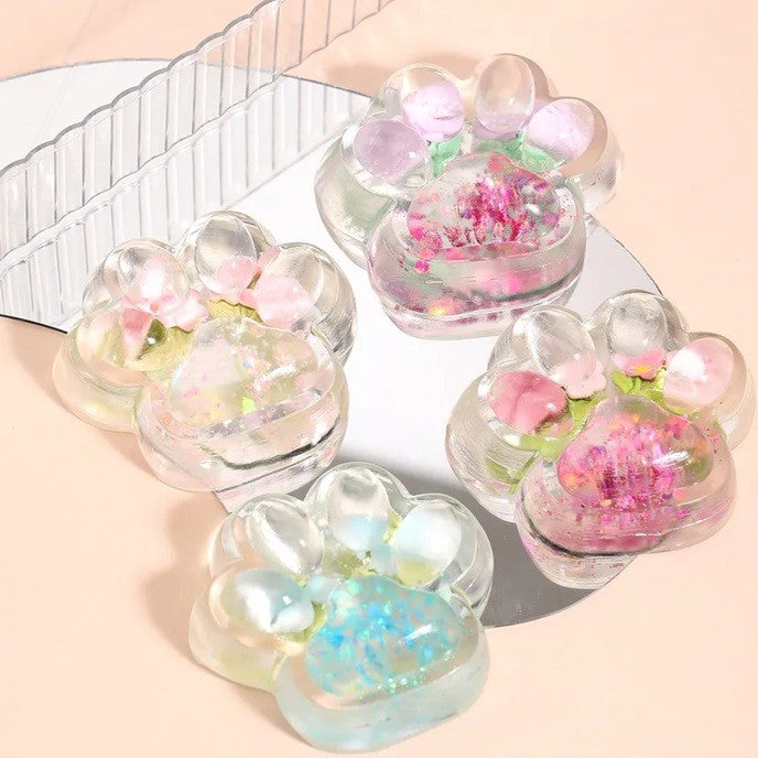 Jucarie Antistres Squishy, Flippy, Labuta de Pisica Pufoasa, cu Revenire Lenta, 7 x 6.5 cm, Model Flori 1, Transparent - vivimall.ro