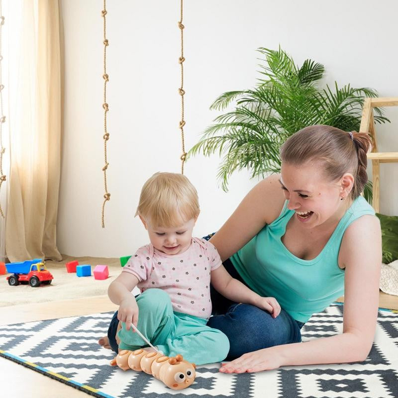 Jucarie mecanica pentru copii Vivimall, omida haioasa, cu cheita, distractiva, se taraste, se misca, 15 x 4 cm, portocaliu - vivimall.ro