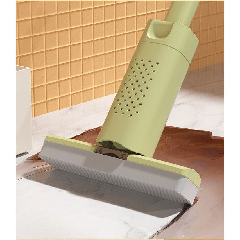 Mini mop verde agățat pe perete prin sistem ventilație găuri fine, economisire spațiu depozitare