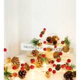 Instalatie Craciun cu baterii, 2 metri, 20 LED-uri tip Ace, conuri de pin si clopotei, Alb Cald, Vivimall - vivimall.ro