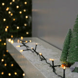 Instalatie Craciun liniara, cu transformator 31V, 10m, alb cald, 100 LED-uri V5, 8 jocuri de lumini, Fir verde, Vivimall - vivimall.ro