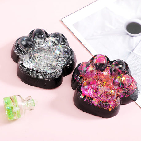 Jucarie Antistres Squishy, Vivimall, cu Revenire Lenta, Squeeze Pinch Family, Model Labuta de Pisica cu Sclipici, 6.5x6 cm, 60g, Ambalaj Transparent, Roz-Negru - vivimall.ro