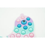 Jucarie Senzoriala Antistres, Simple Dimple, Delfin, Macarons - vivimall.ro