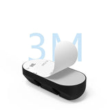Set organizatoare cabluri din silicon negru aplicate pe suprafață de sticlă, vedere laterală și față