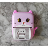 Set Mini Imprimanta Foto Portabila, Vivimall, Include: 1x Set de Markere, 5x Role de Hartie Termica, 5x Role Hartie Adeziva, Incarcare USB, Bluetooth, Print Alb-Negru, Model Pisicuta, Roz - vivimall.ro